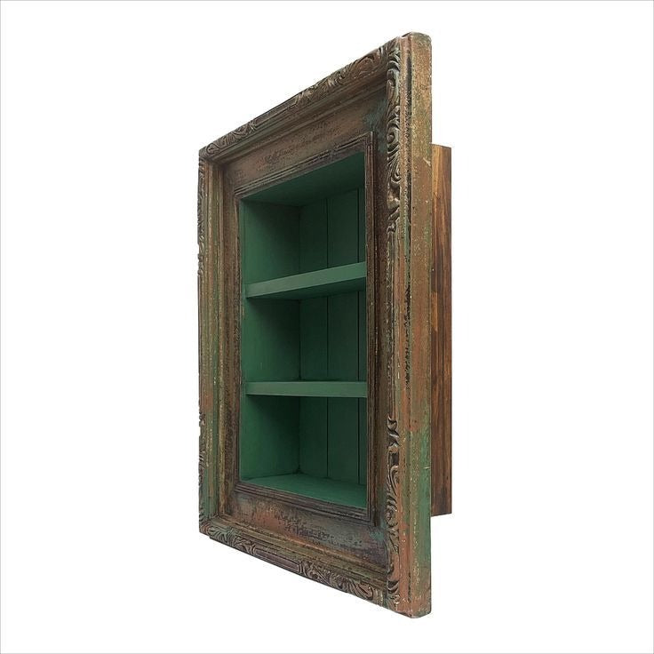 Vintage wall decor with a brass idol shelf mounted on a handcrafted wooden frame. This antique-style shelf combines functionality and beauty, providing the perfect space for displaying brass idols, candles, or small indoor plants in traditional and contemporary interiors