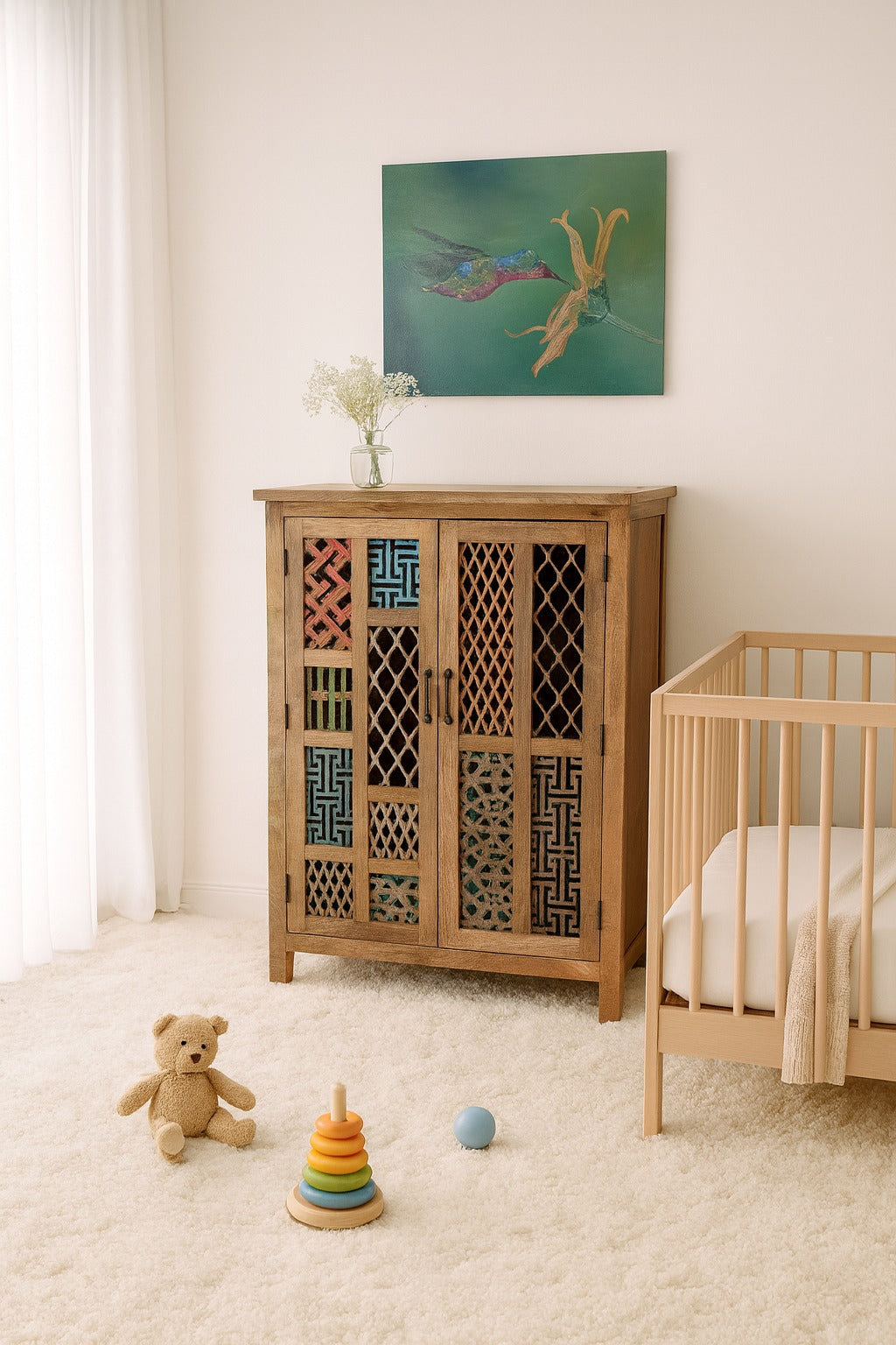 Nursery room with wooden cabinet, crib, and toys on a light-colored floor.