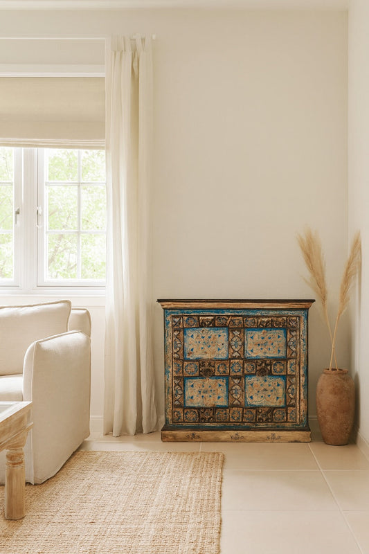 Decorative cabinet with floral patterns in a living room setting