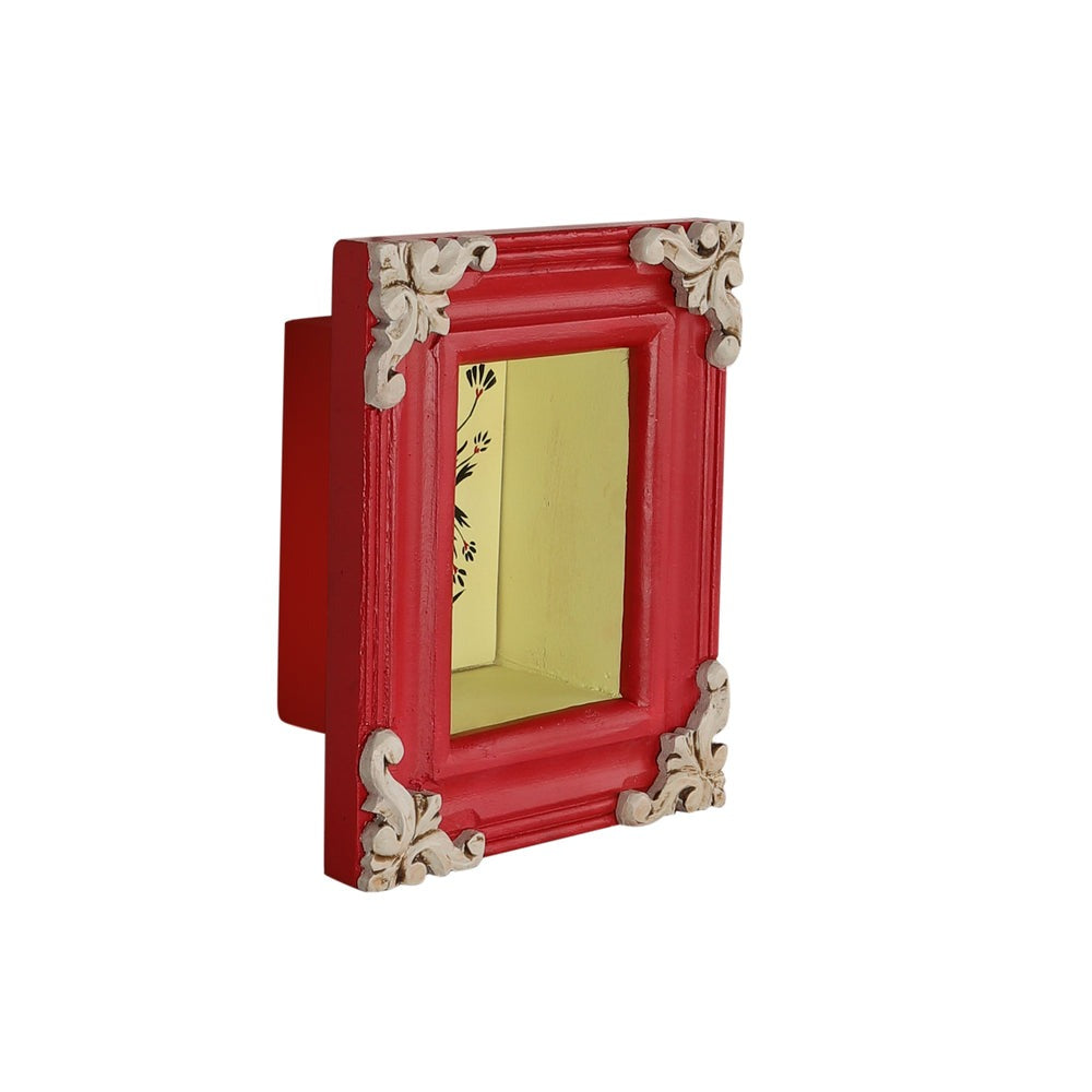 Handcrafted brass idol shelf with a wall-mounted structure, featuring antique-style carvings and a polished brass finish. This shelf blends functionality with artistic elegance, making it ideal for pooja rituals or enhancing your home’s wall decor."