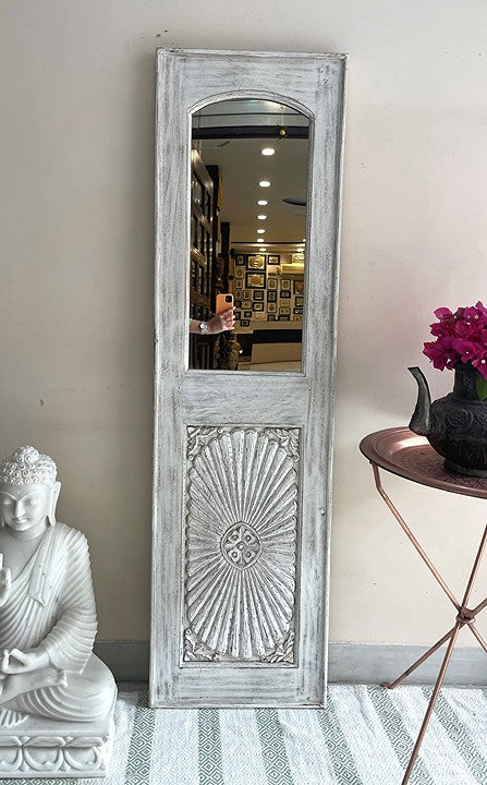 Large black framed jharokha mirror with a big vintage mirror insert, combining traditional Indian designs with modern decorative trends.