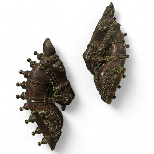 Pair of horse head sculptures, hand-carved with intricate detailing, showcasing traditional Indian craftsmanship in rustic wall art. wall decor,
wall art,
wall accents,
large wall art,
big wall decor,
outdoor wall art,
wall hanging,
vintage wall decor,
rustic wall decor,
antique wall decor,
rustic wall art,
vintage home decor,
home decor,
antique home decor