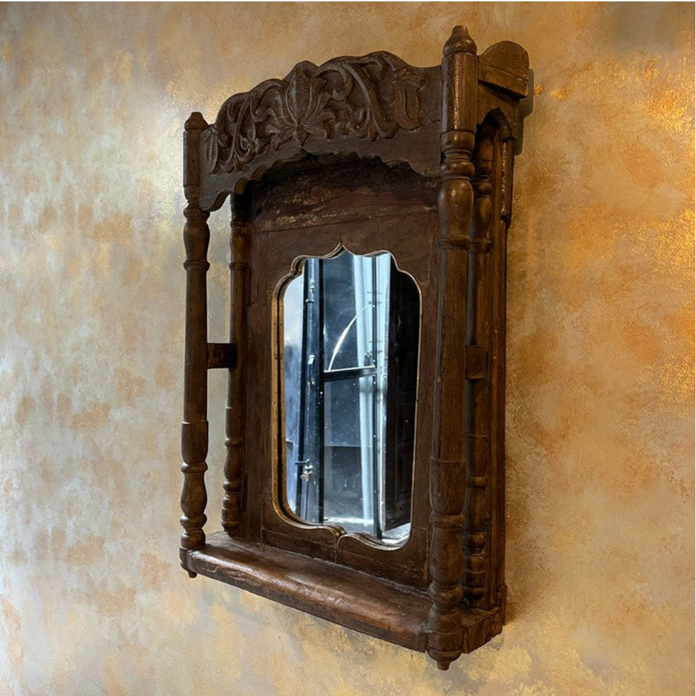 Vintage bathroom mirror with black framed design, adding classic elegance to your space